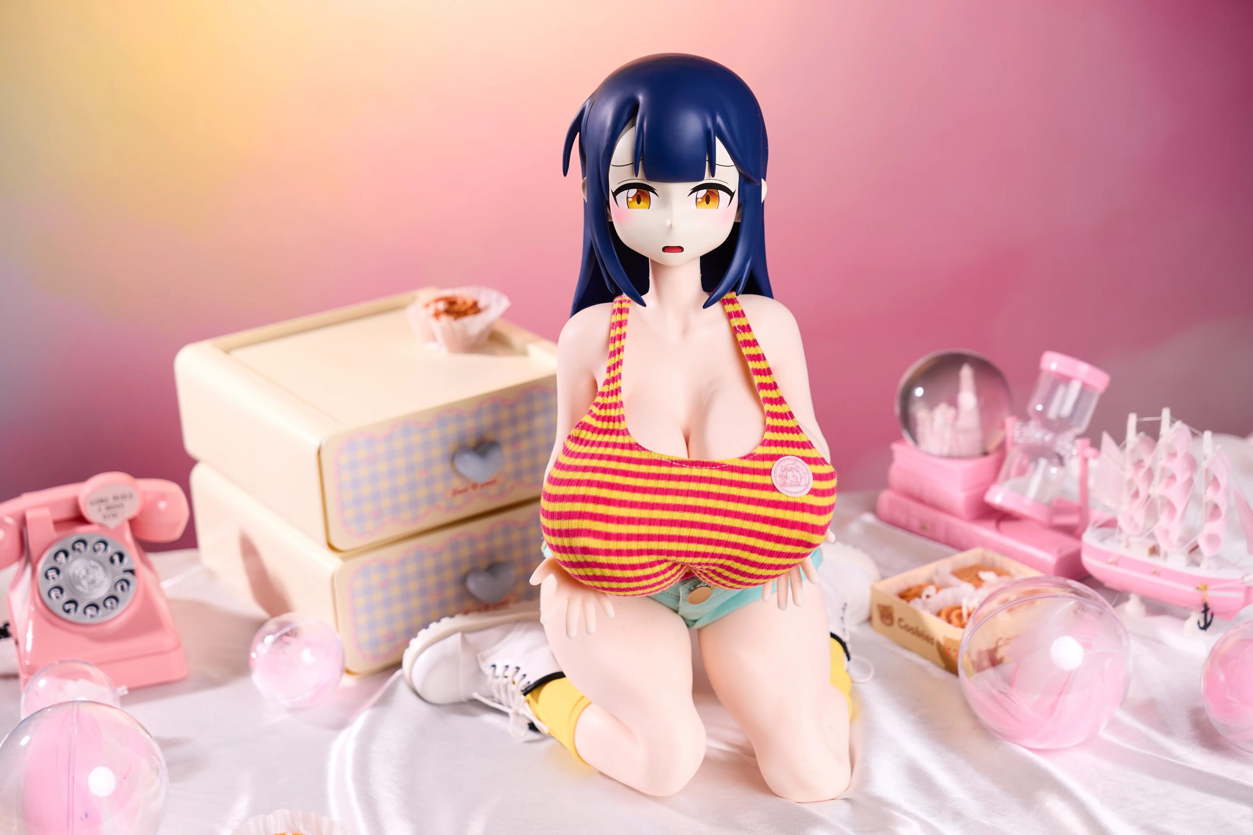 Side view of Audrey Anime Figure wearing pink striped crop top and blue skinny denim-style shorts