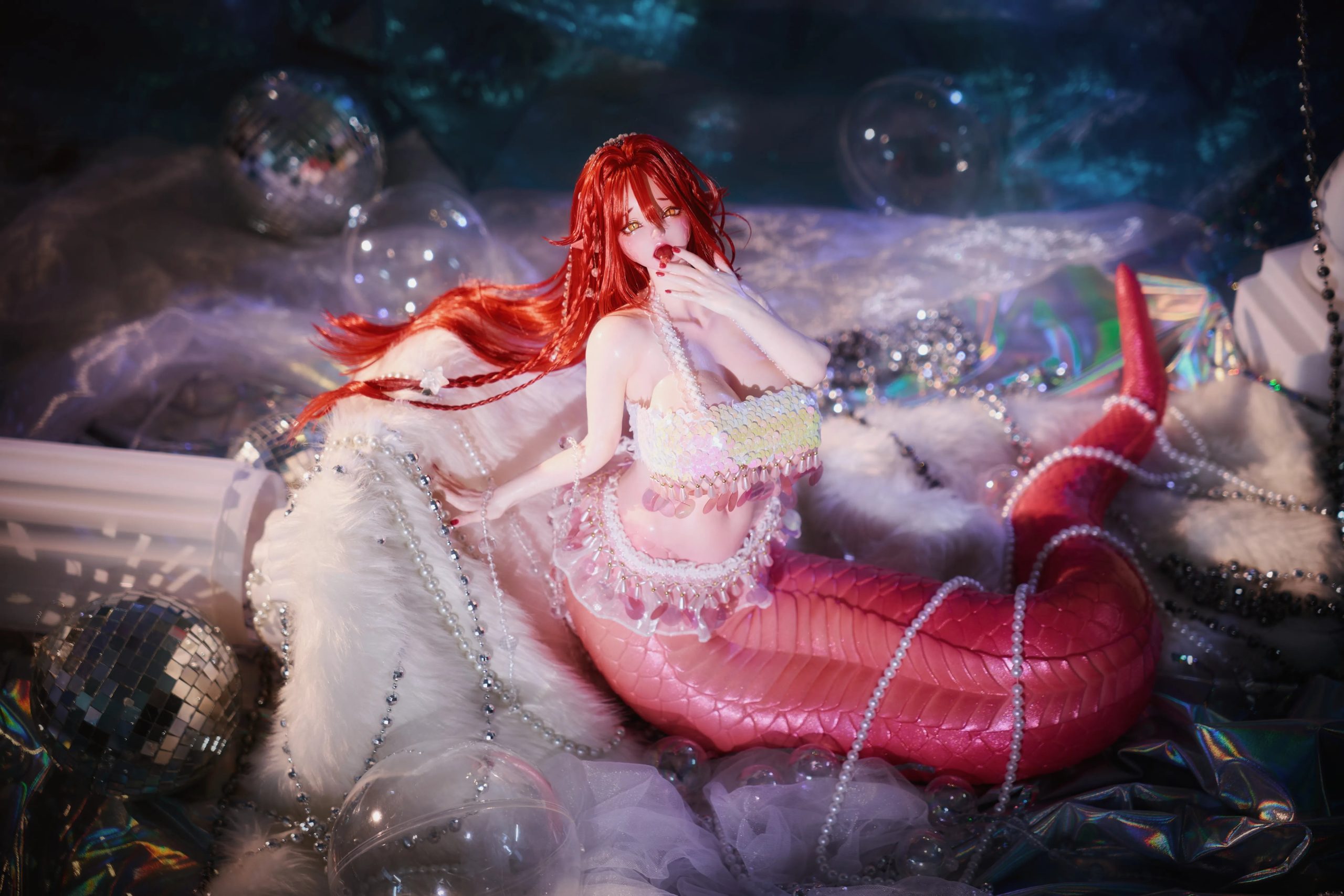 Full body view of Mera figure showing transition from human torso to pearlescent pink snake tail lamia design