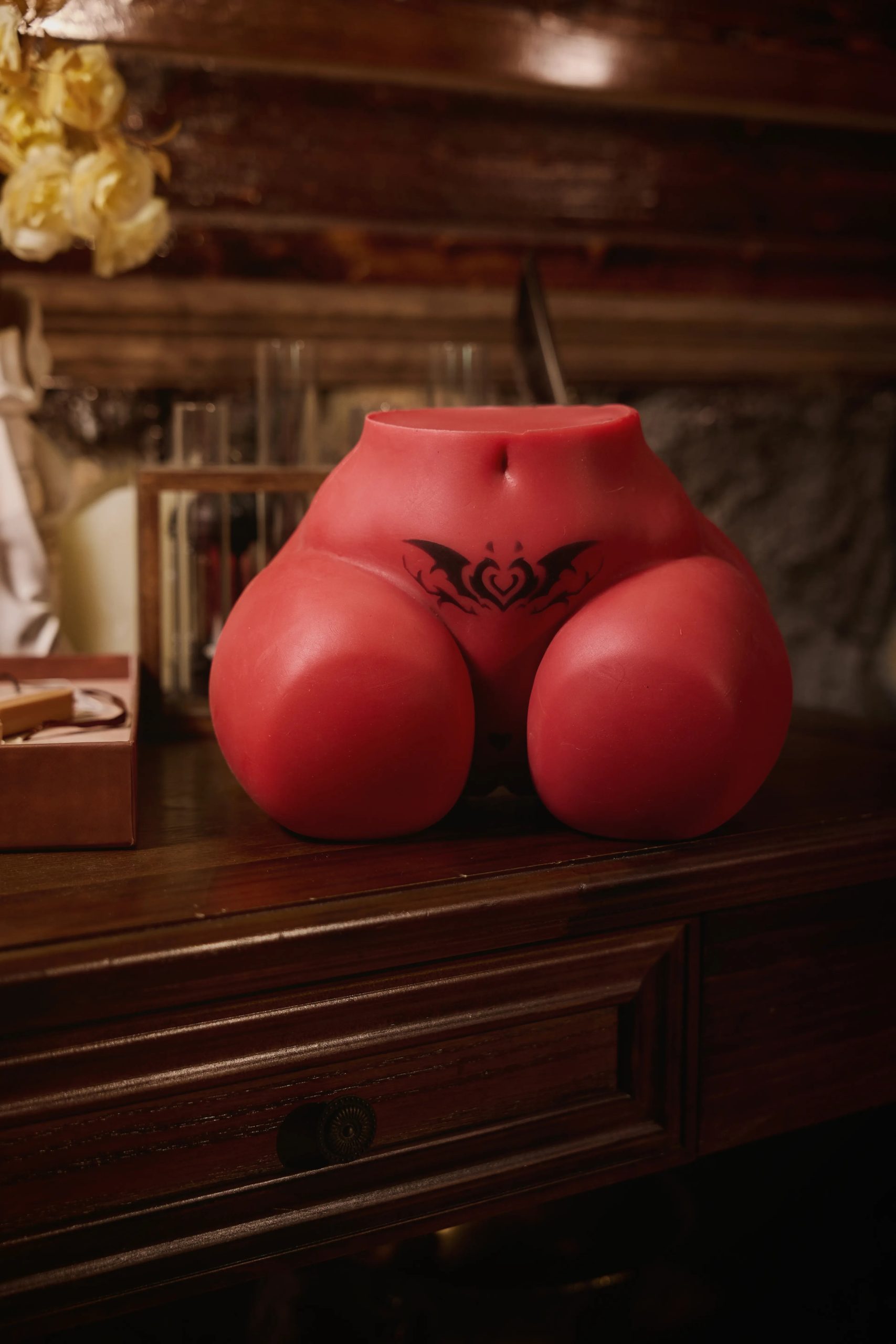 Rear-facing angle image showing the dual entry channels and the iconic succubus demon tail sculpture