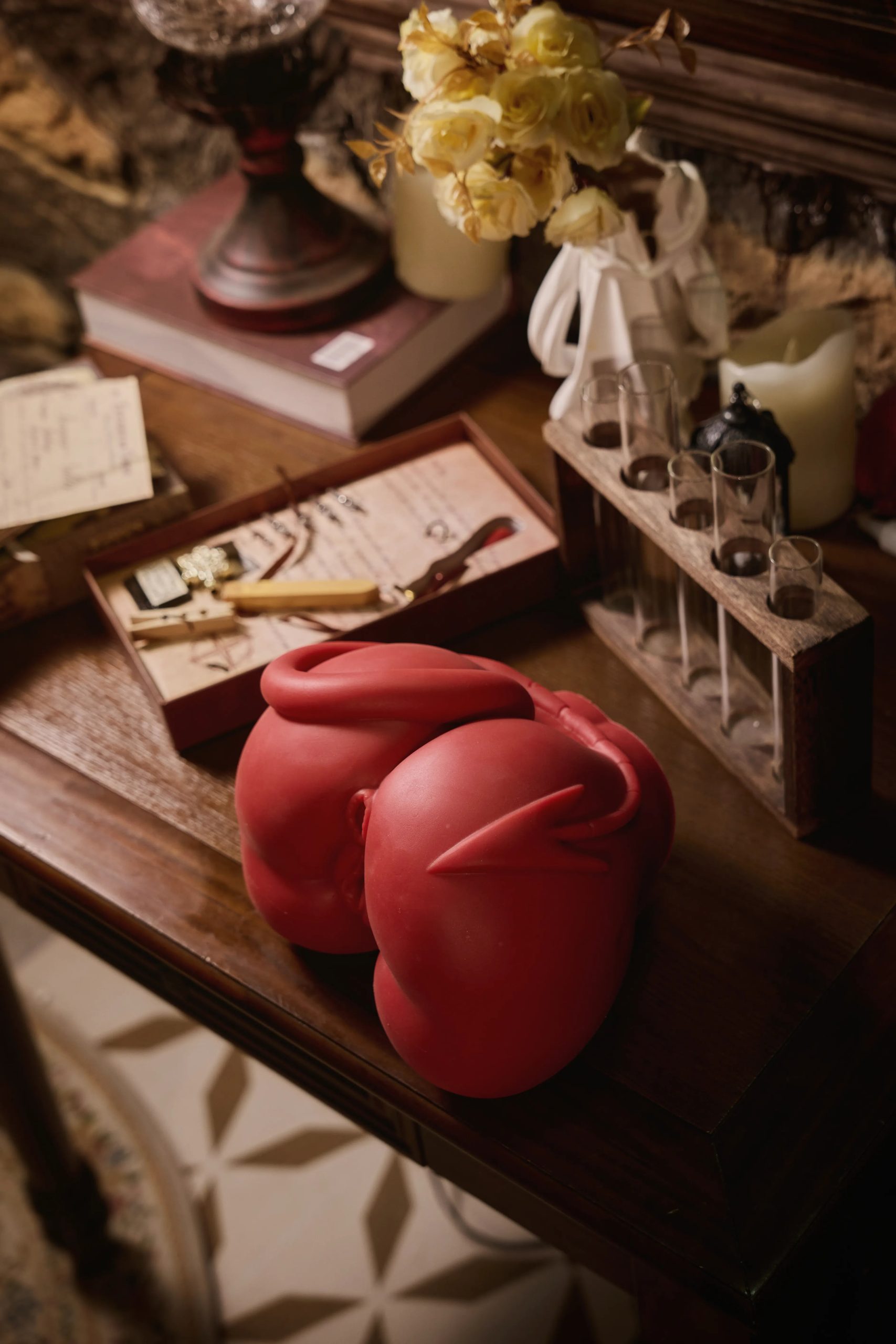 Frontal view photography of MRL Meru the Succubus red medical silicone torso sex doll