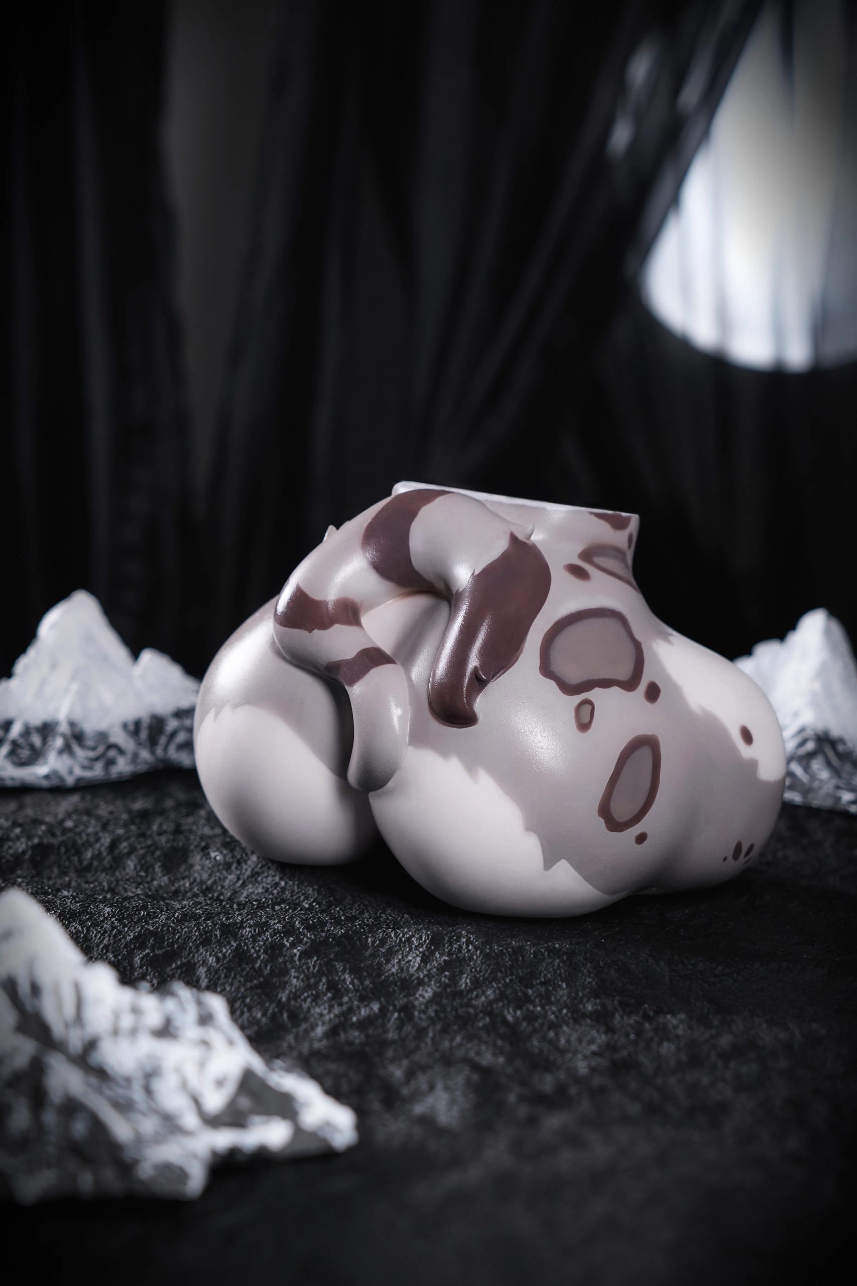 Front studio view of the Shira furry sex doll torso with snow leopard markings