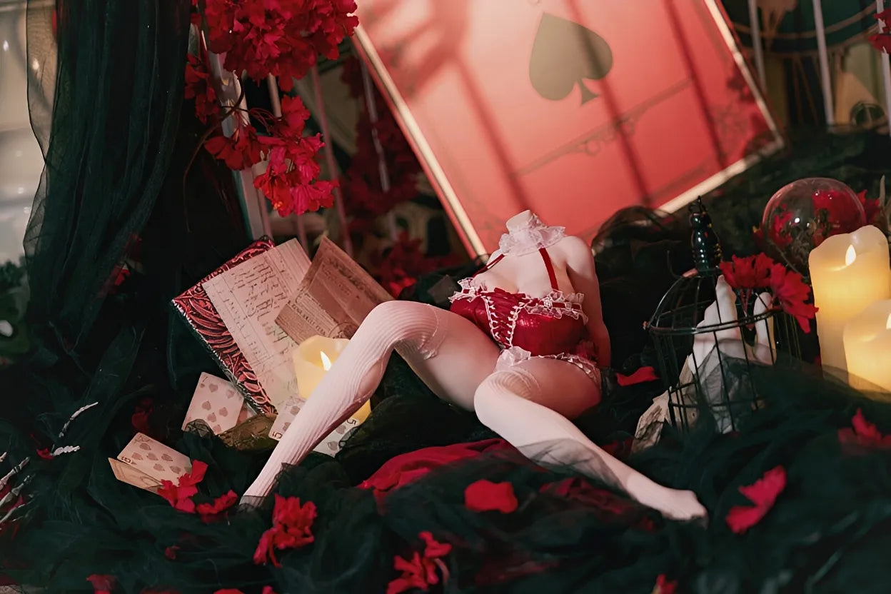 Red and white maid lingerie sex doll clothing in collector display setup