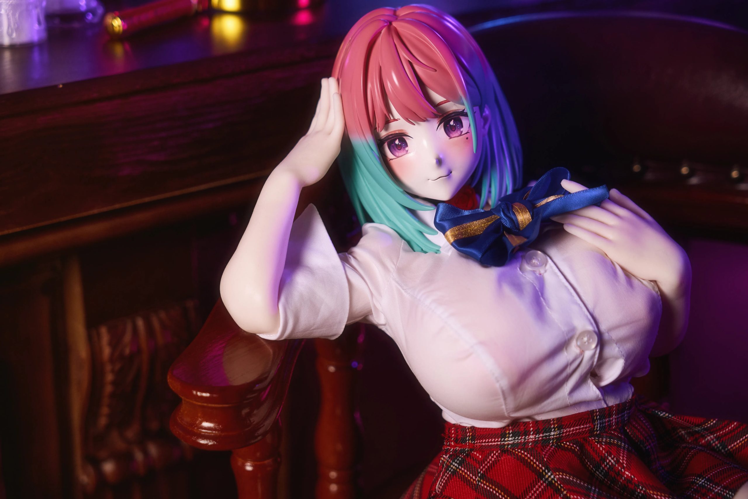 Close-up of Reiyu GuiGui sex doll face showing pink and blue gradient hair and teardrop mole