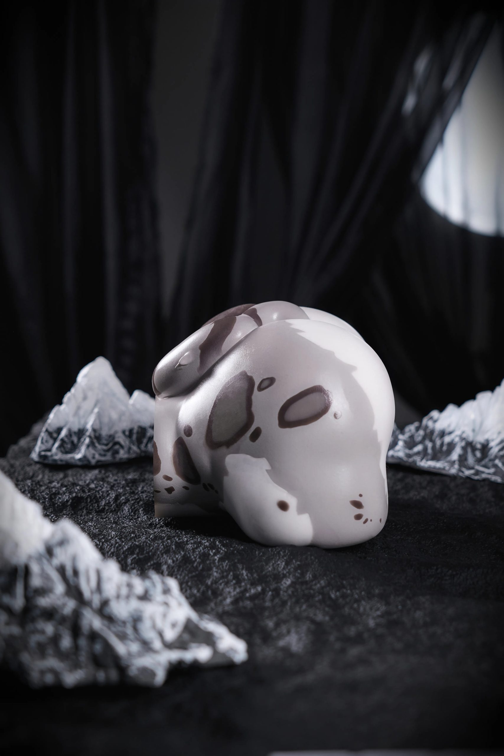 Side view of the Shira torso sex doll showing its curved profile and sculpted tail